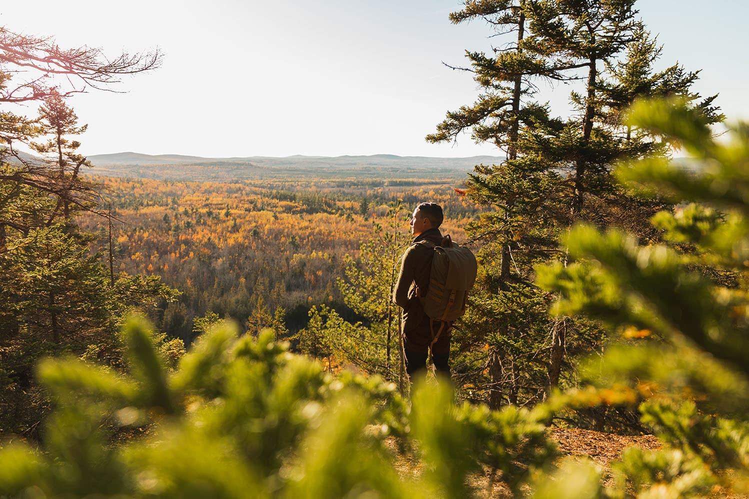 Hiker looking at the view of mountains in front of him